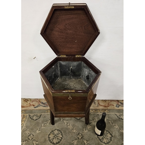 87 - Georgian Mahogany Wine Cooler, octagonal shaped, with brass banding and a tin lined interior, on tap... 