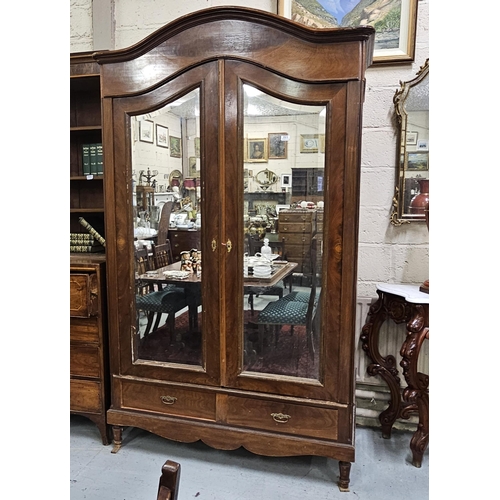 321 - 19thC French Mahogany Wardrobe, the arched and moulded pediment over two bevelled mirror doors, on t... 