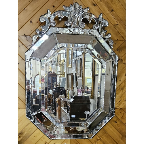 247 - Fine Venetian Overmantle / Pier Mirror, a decoratively scrolled pediment over an octagonal shaped bo... 