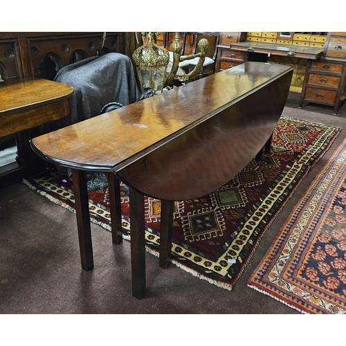 343 - Georgian (with later alterations) Mahogany Hunt / Dining Table, with bow-shaped drop end leaves, on ... 