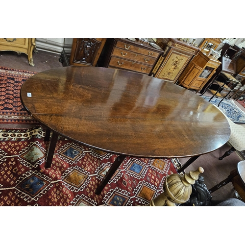 343 - Georgian (with later alterations) Mahogany Hunt / Dining Table, with bow-shaped drop end leaves, on ... 