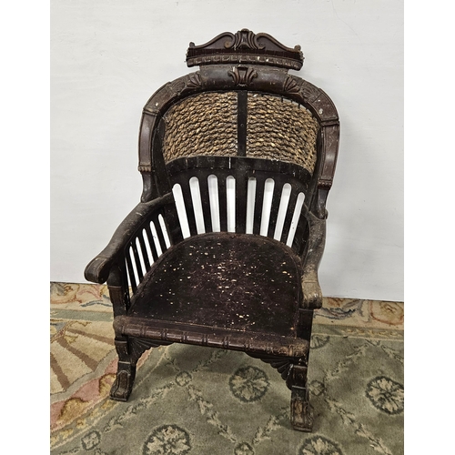 17 - Unusual Carved Hardwood Continental Armchair, with a shaped pediment and rope edged upper panel, 1m ... 