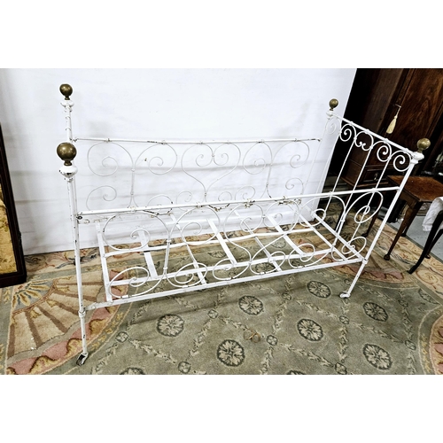 332 - Victorian White Metal Cot with brass finials, decorative scrolls, on castors, 70cmW x 1.45mL