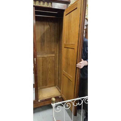 319 - Fine Tall 19thC French Armoire, the two doors opening to shelves and a hanging closet, intricately i... 