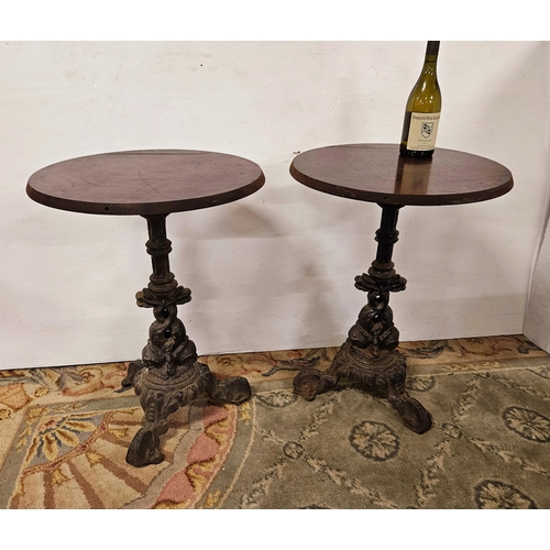 39 - Matching Pair of Bar Tables, with circular teak tops above decorative metal bases, on 3 scrolled fee... 