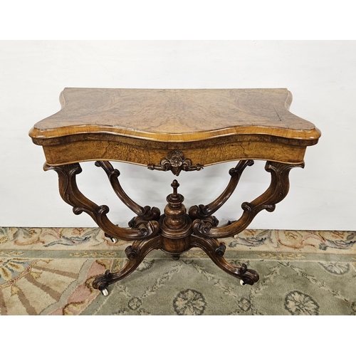 74 - Victorian Walnut Serpentine-shaped Card Table, on four decorative cabriole supports, porcelain casto... 