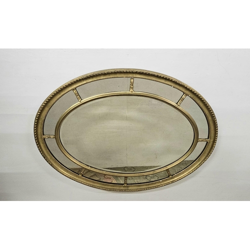 83 - Good early 20thC Adams Style Overmantle Wall Mirror, oval-shaped with compartmental glass, in a carv... 