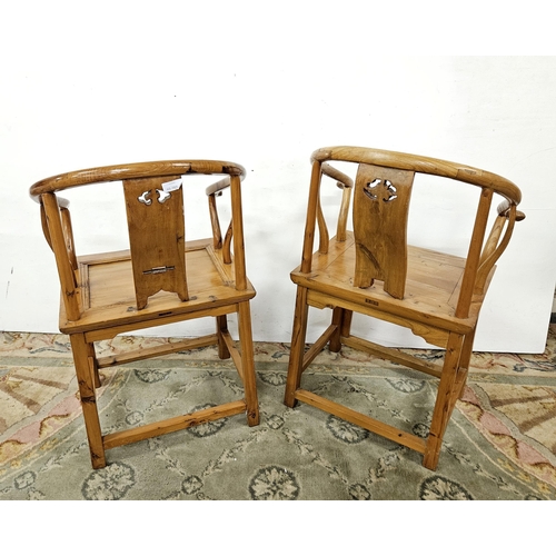 118 - Pair of Chinese Elm Horseshoe Chairs, the decorative splats featuring carved oriental females, on st... 