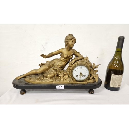 168 - Early 20thC Mantle Clock - a large reclining woman leaning to a small enamel faced clock, mtd on a 3... 