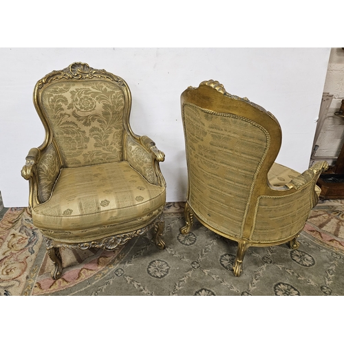 18 - Pair of carved gilt framed Armchairs, on cabriole front legs, the seats, backs & cushions covered wi... 