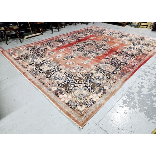 235 - Old Persian Wool Floor Rug, red ground with a central medallion of greens and blues, 4.1m x 3.08m (s... 