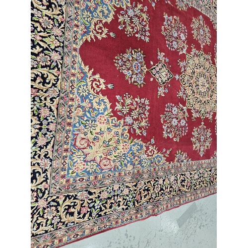 238 - Rich red ground Persian Kerman Carpet, traditional floral medallion design, hints of blue (border) 3... 