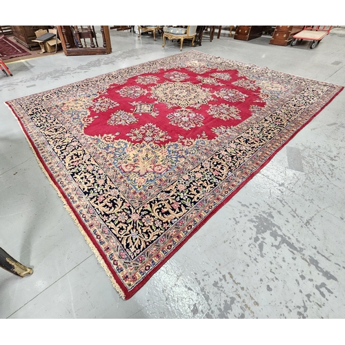 238 - Rich red ground Persian Kerman Carpet, traditional floral medallion design, hints of blue (border) 3... 