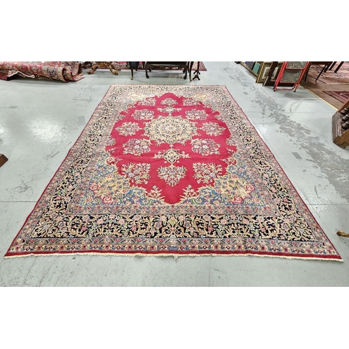 238 - Rich red ground Persian Kerman Carpet, traditional floral medallion design, hints of blue (border) 3... 