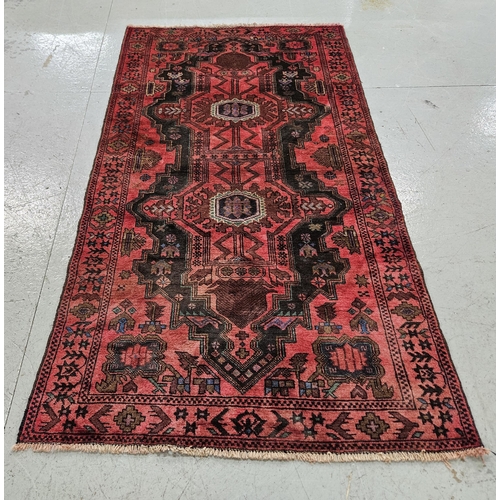 249 - Red ground Persian Heriz Rug, traditional double medallion design, hints of green, blue 2.08m x 1.12... 