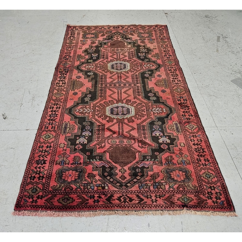 249 - Red ground Persian Heriz Rug, traditional double medallion design, hints of green, blue 2.08m x 1.12... 