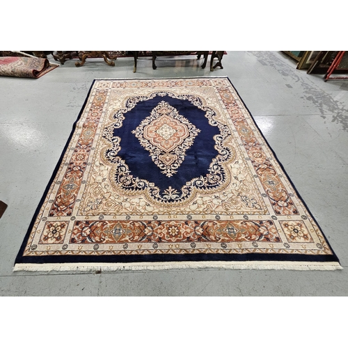 255 - Rich blue ground hand woven Persian Rug with a central diamond medallion, 3m x 2.4m