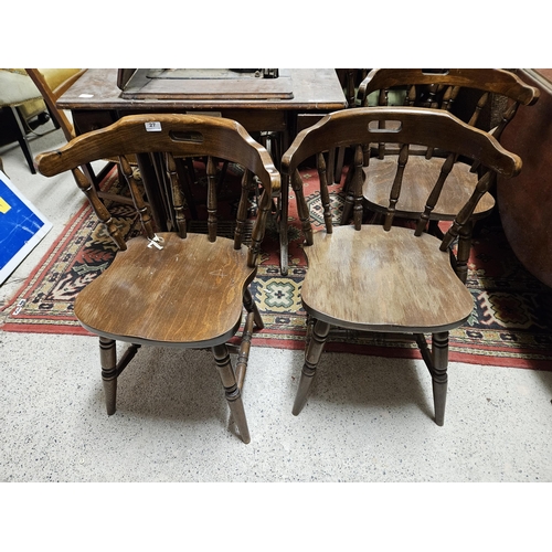 27 - Set of 4 bow-back Teak Chairs, on turned legs, with integrated handles (bar design) (4)