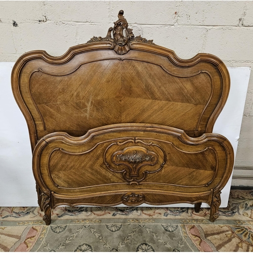 272 - French Walnut Bed Ends - the decoratively carved pediment over a wave shaped headboard, the similarl... 