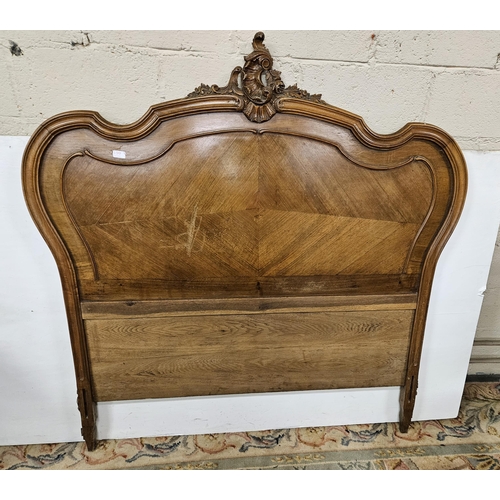 272 - French Walnut Bed Ends - the decoratively carved pediment over a wave shaped headboard, the similarl... 