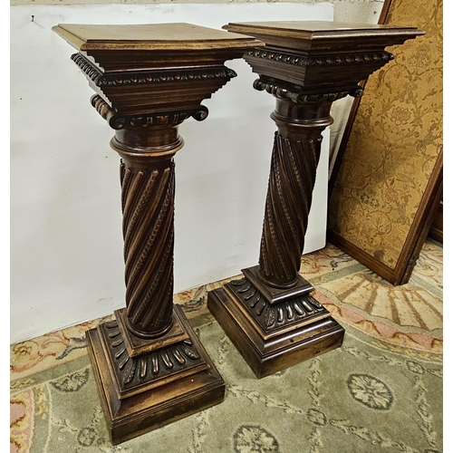 284 - Matching Pair of 19thC carved walnut Pedestals, decoratively carved corinthian column bodies, on squ... 