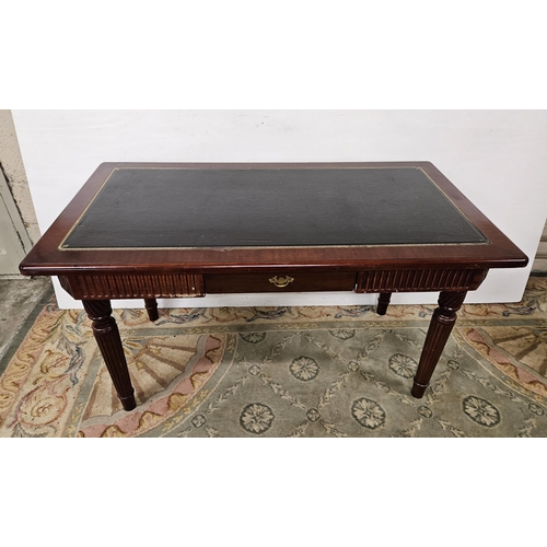 37 - Reproduction mahogany colour Writing Table with a tooled border green leatherette top, an apron draw... 