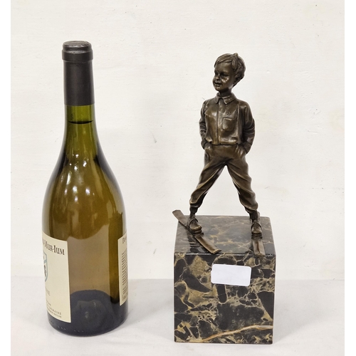 75 - French Table Bronze - Boy on Skis, on a tall black and brown marble base, stamped 