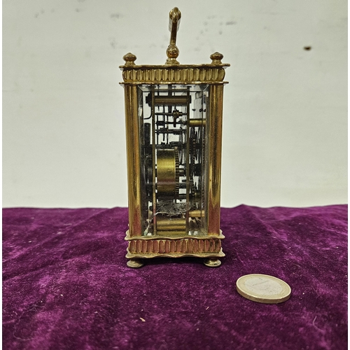 171 - Finely decorated Brass Cased small Carriage Clock, with striking bell, a white dial with month hand,... 