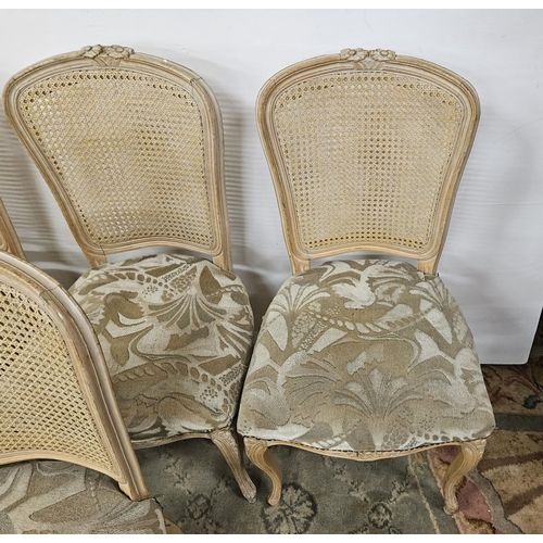 25 - Matching Set of 6 French Cane Back Bistro Chairs, painted cream, with padded seats, on sabre front l... 