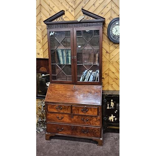 318 - 19thC Mahogany Two-Door Bookcase, with a broken pediment over the nice Chippendale fretwork and 2 gl... 