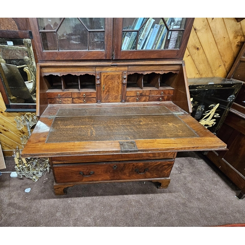 318 - 19thC Mahogany Two-Door Bookcase, with a broken pediment over the nice Chippendale fretwork and 2 gl... 