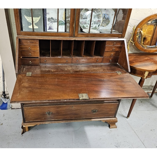 276 - Early 20thC Slope-fronted Mahogany Bureau Bookcase, with 2 glazed doors, the based having a bureau d... 