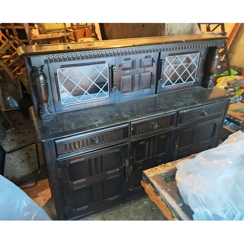 501 - Ercol Oak Sideboard - two glass doors above drawers and a cabinet, 5 feet wide