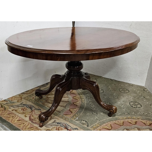 55 - Oval Topped Mahogany Dining Table on a pod with 4 cabriole legs, 1.3mW x 1.1W, polished condition.