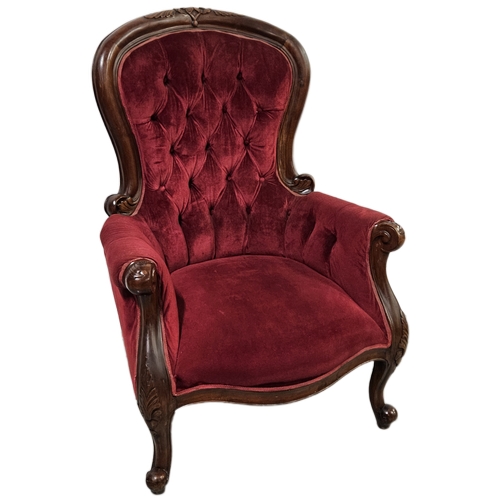 24 - Mahogany Victorian style Armchair with cabriole arms and feet, upholstered with plush red velvet, bu... 