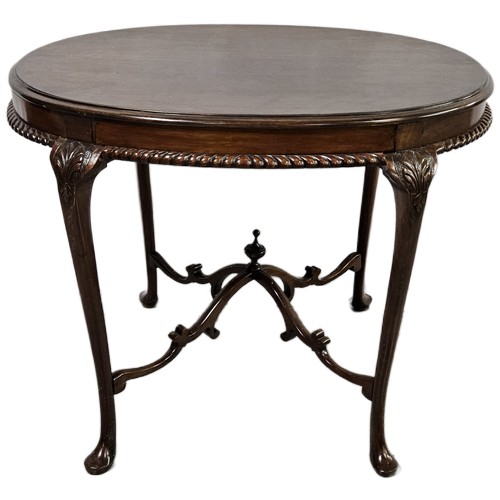 48 - Oval topped mahogany Centre Table with a carved rim & curved stretchers, pad feet, 73cmH x 94cmW
