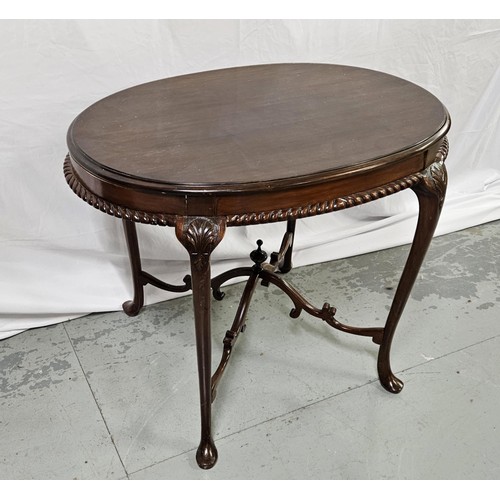 48 - Oval topped mahogany Centre Table with a carved rim & curved stretchers, pad feet, 73cmH x 94cmW