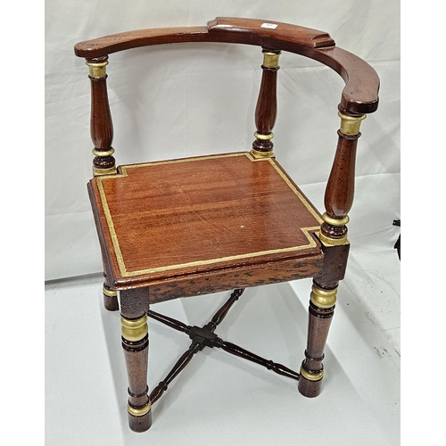 17 - Continental Walnut Corner Armchair, with gold painted highlights, on round legs with a low cross str... 