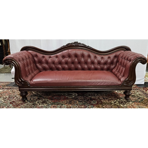 27 - WMIV Mahogany Settee, with floral motif to the shaped back, on 4 turned legs, castors, red buttoned ... 