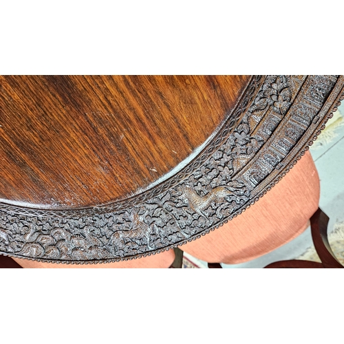 47 - Anglo Indian 19thC Centre/Occasional Table, with intricate borders featuring carvings of griffins an... 