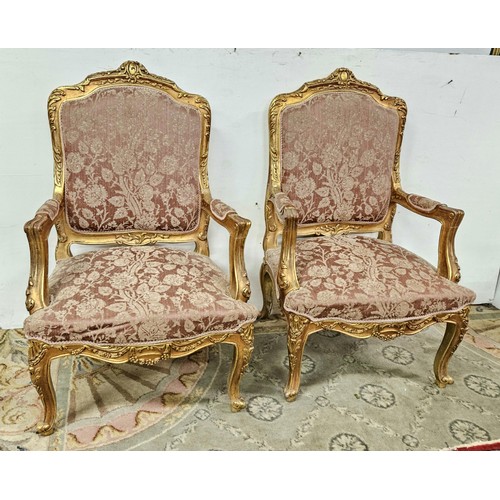 12 - Matching Pair of carved gilt wood French Salon Armchairs, with decorative finials, cabriole feet, up... 