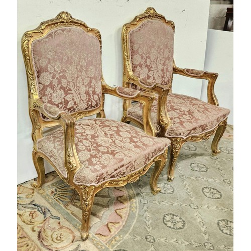 12 - Matching Pair of carved gilt wood French Salon Armchairs, with decorative finials, cabriole feet, up... 