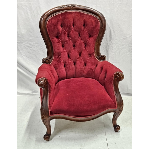24 - Mahogany Victorian style Armchair with cabriole arms and feet, upholstered with plush red velvet, bu... 
