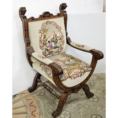 14 - French Throne Armchair, with carved lion head finials, the stuffed seat and back covered in needlepo... 