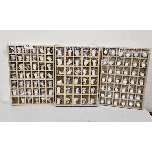 37 - 3 Wall Displays of crested porcelain thimbles: 126 pieces