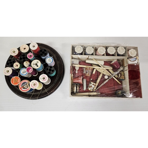 55 - A small box of exceptional sewing tools, thimbles etc., with 6 special decorative covers for the spo... 