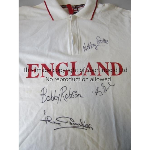 828 - ENGLAND FOOTBALL AUTOGRAPHS      A used England official zip-up white polo shirt signed in black mar... 