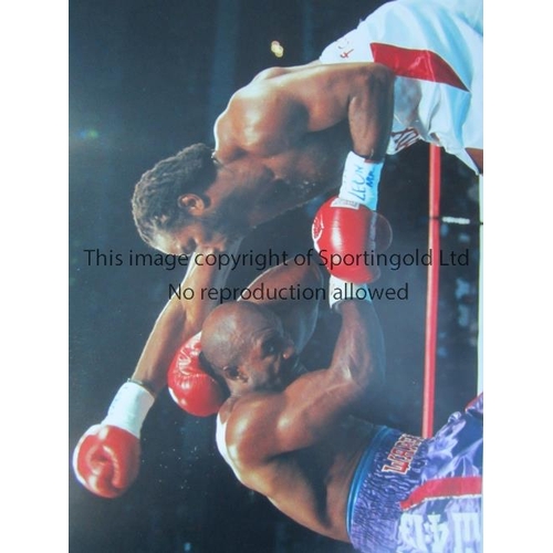 378 - LENNOX LEWIS            Twenty seven large colour photos with duplication of Lennox Lewis in action ... 