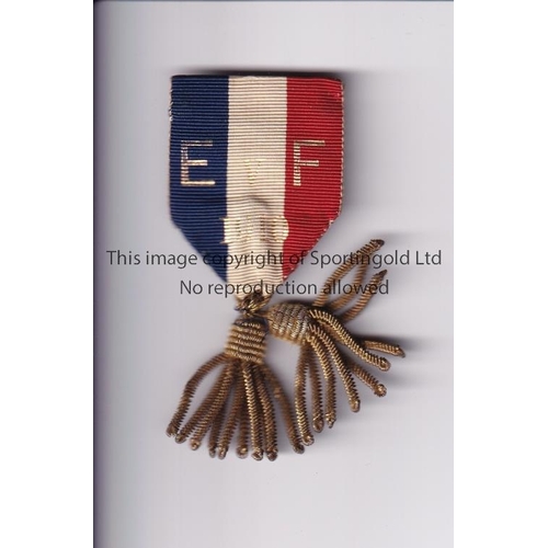 547 - F.A. STEWARDS BADGE / ENGLAND V FRANCE 1910       Blue, white and red ribbon badge for the Internati... 