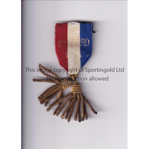 548 - F.A. STEWARDS BADGE 1911      Ribbon badge red, white and blue with faded print 